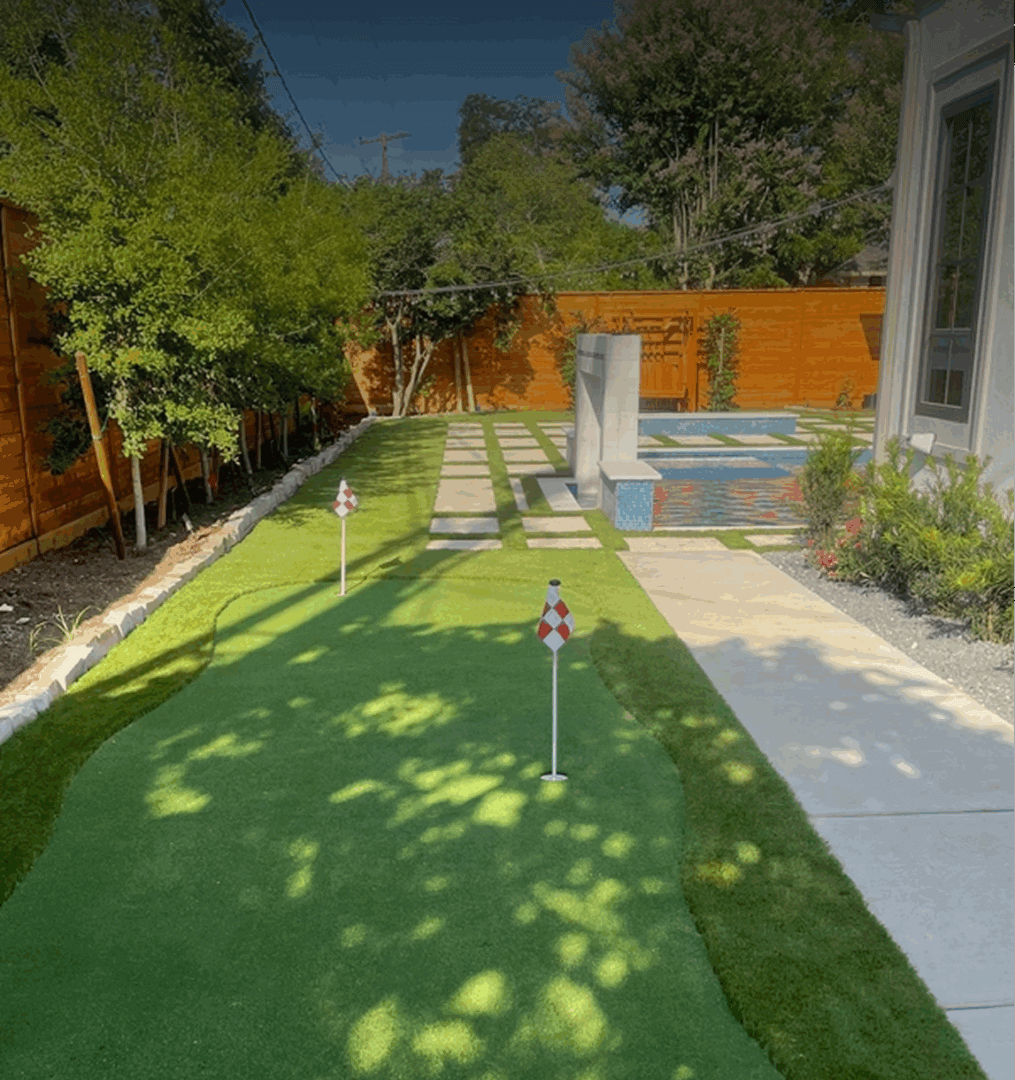 Backyard with putting green and small pool.