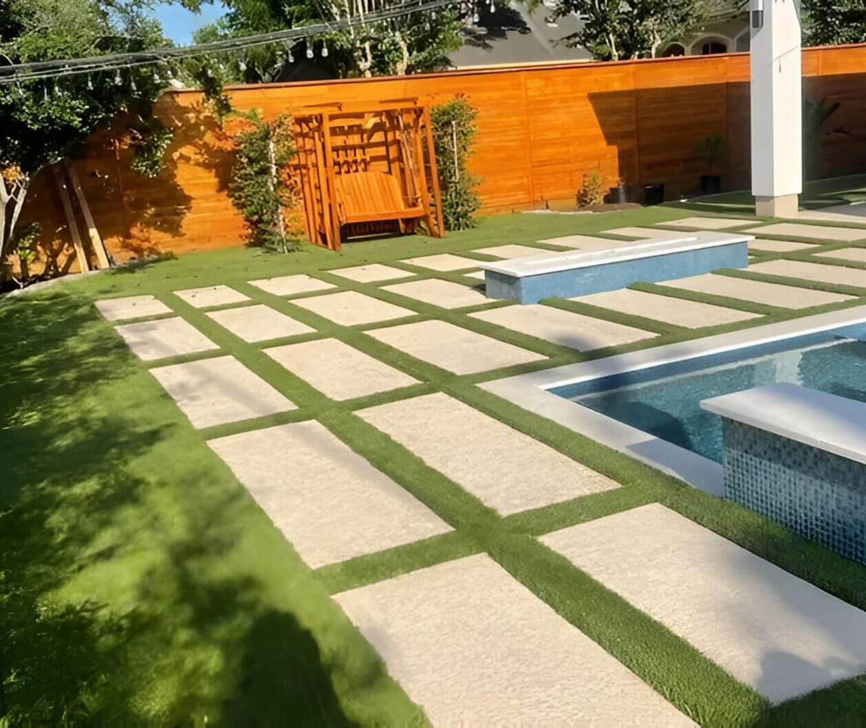 Modern backyard with pool and patio design.